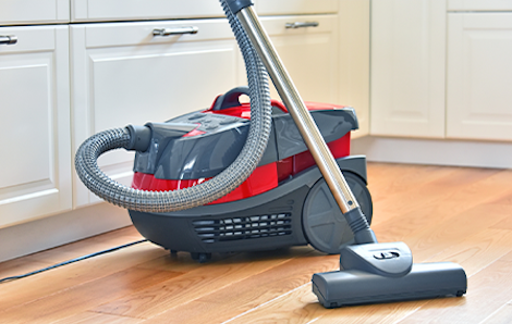 Photograph of a standard vacuum cleaner in the kitchen.