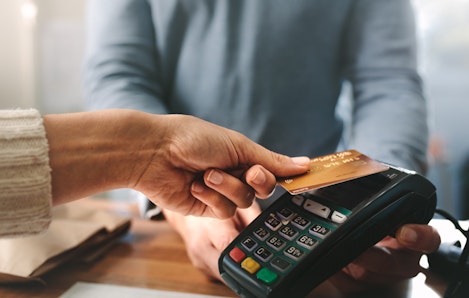 Photo of woman paying with card