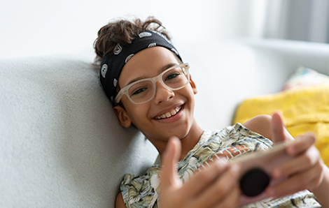 Teenager using smartphone.