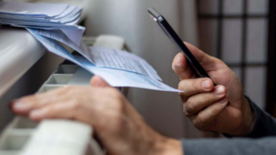 Image of electricity bills on a heater
