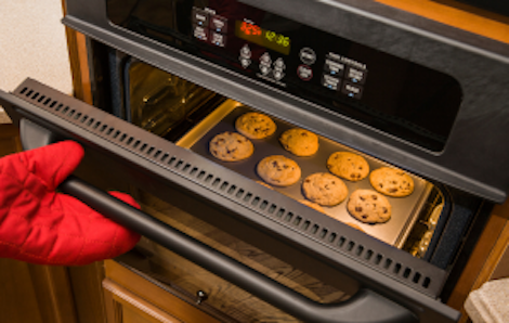 Image of an oven baking cookies