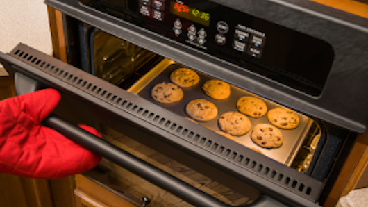 Image of an oven baking cookies