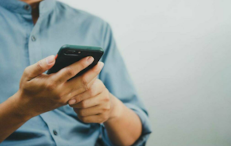 Image of person using their phone