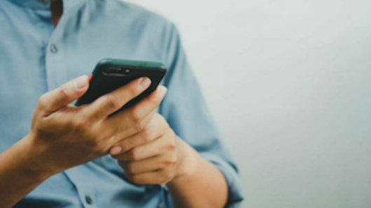 Image of person using their phone
