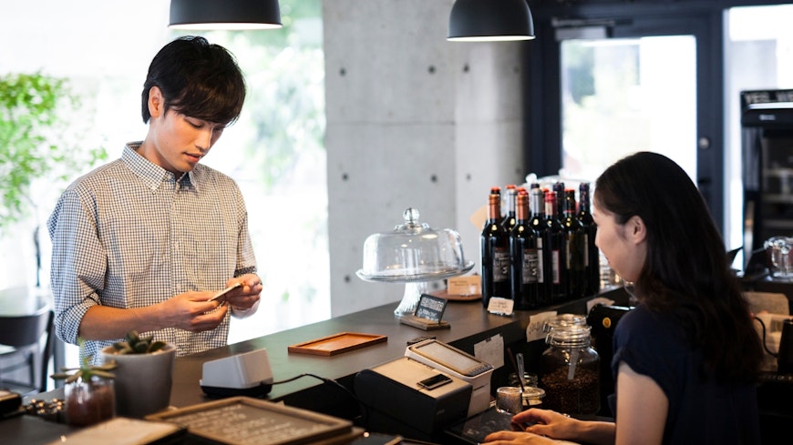 Man paying at counter