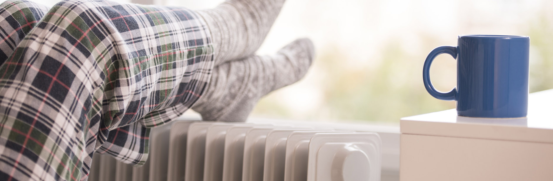 Keeping warm in winter with electric heater and tea
