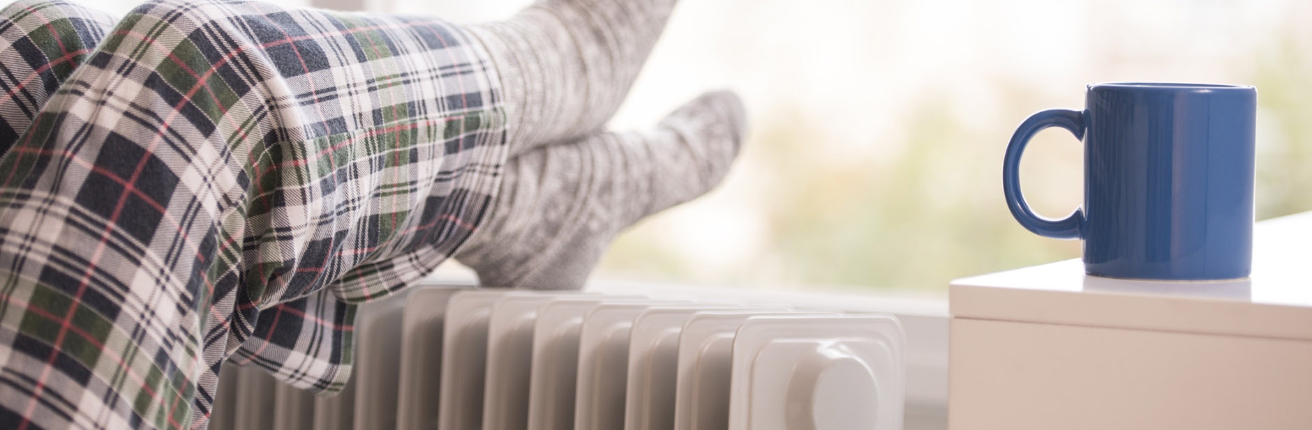 Keeping warm in winter with electric heater and tea