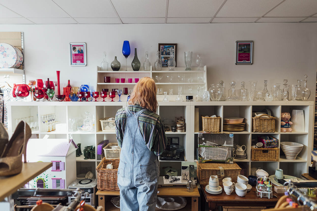 Woman looking at second-hand items.