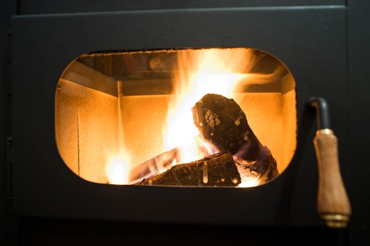 There is no known lower "safe" limit for the pollution that woodburners produce.