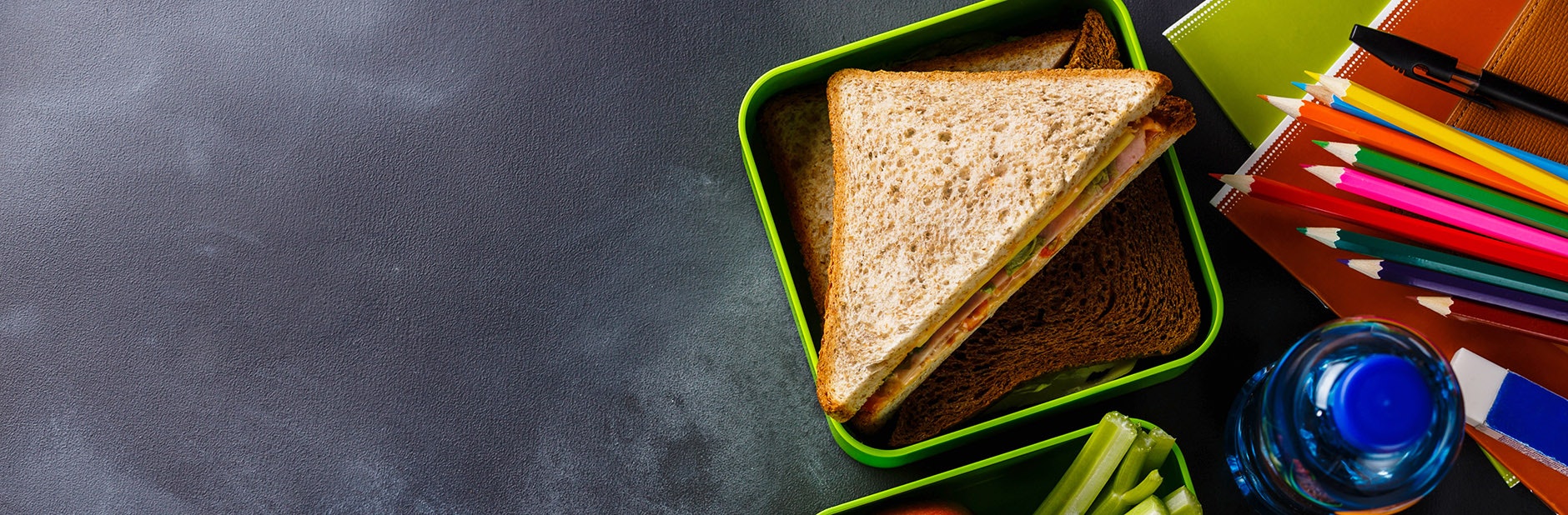 Lunchbox with sandwich and fruit and veg