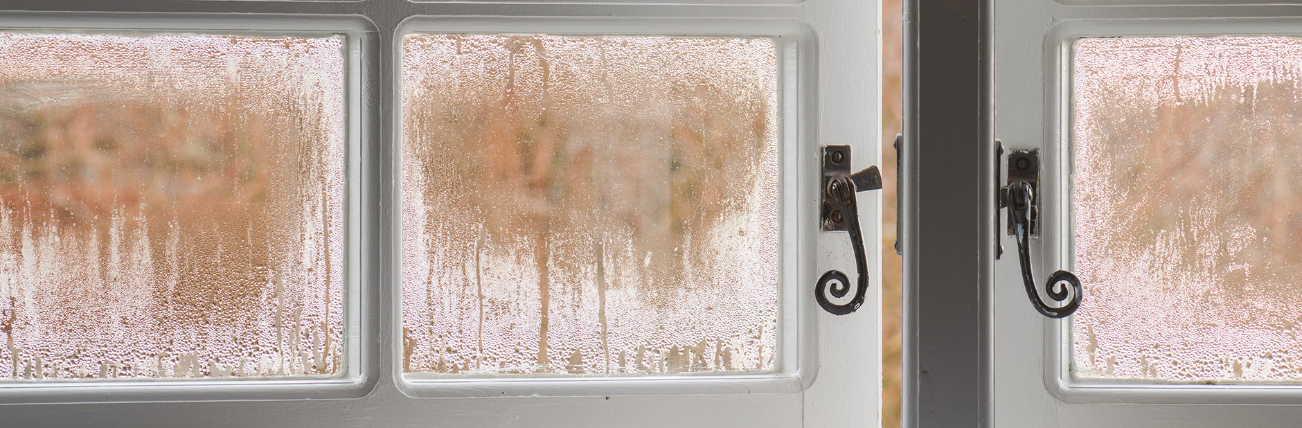 window with condensation cracked open