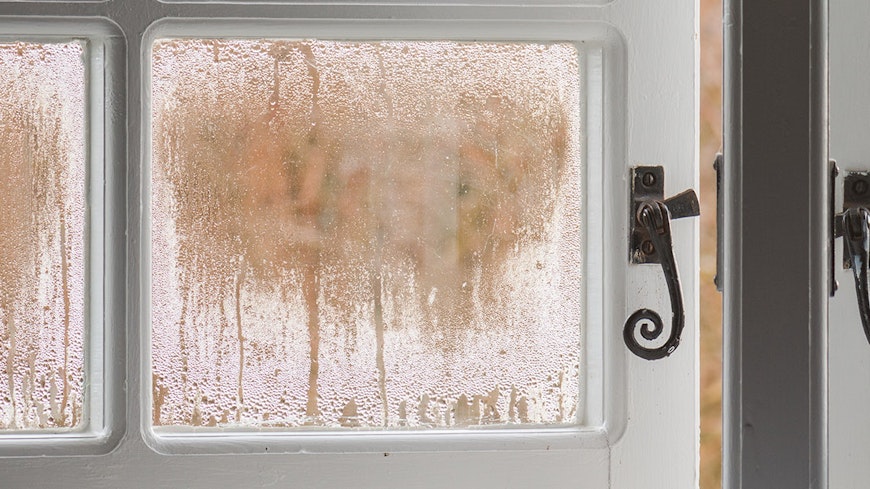 window with condensation cracked open