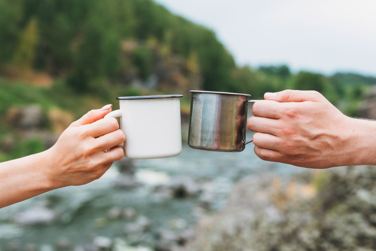 Coffee mug on a log