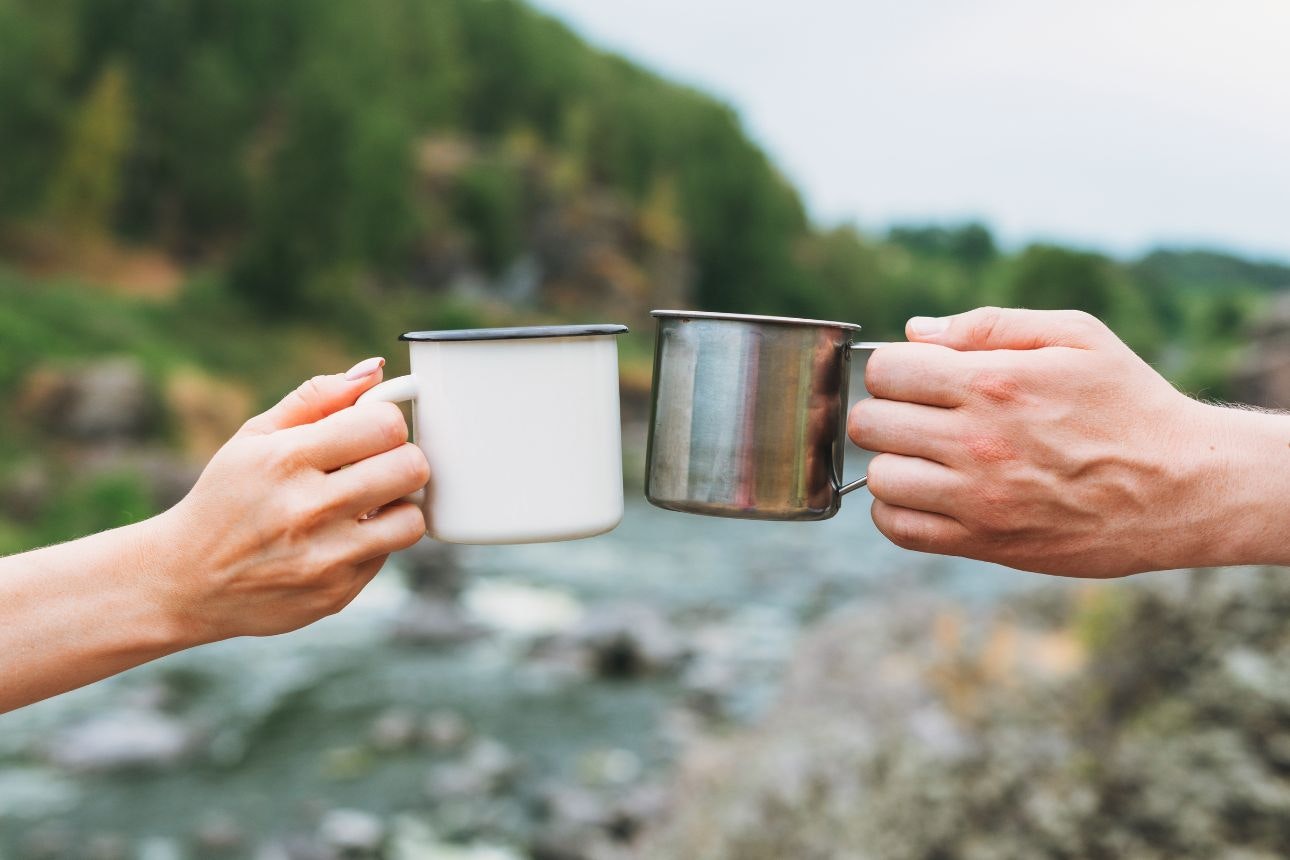 Coffee mug on a log