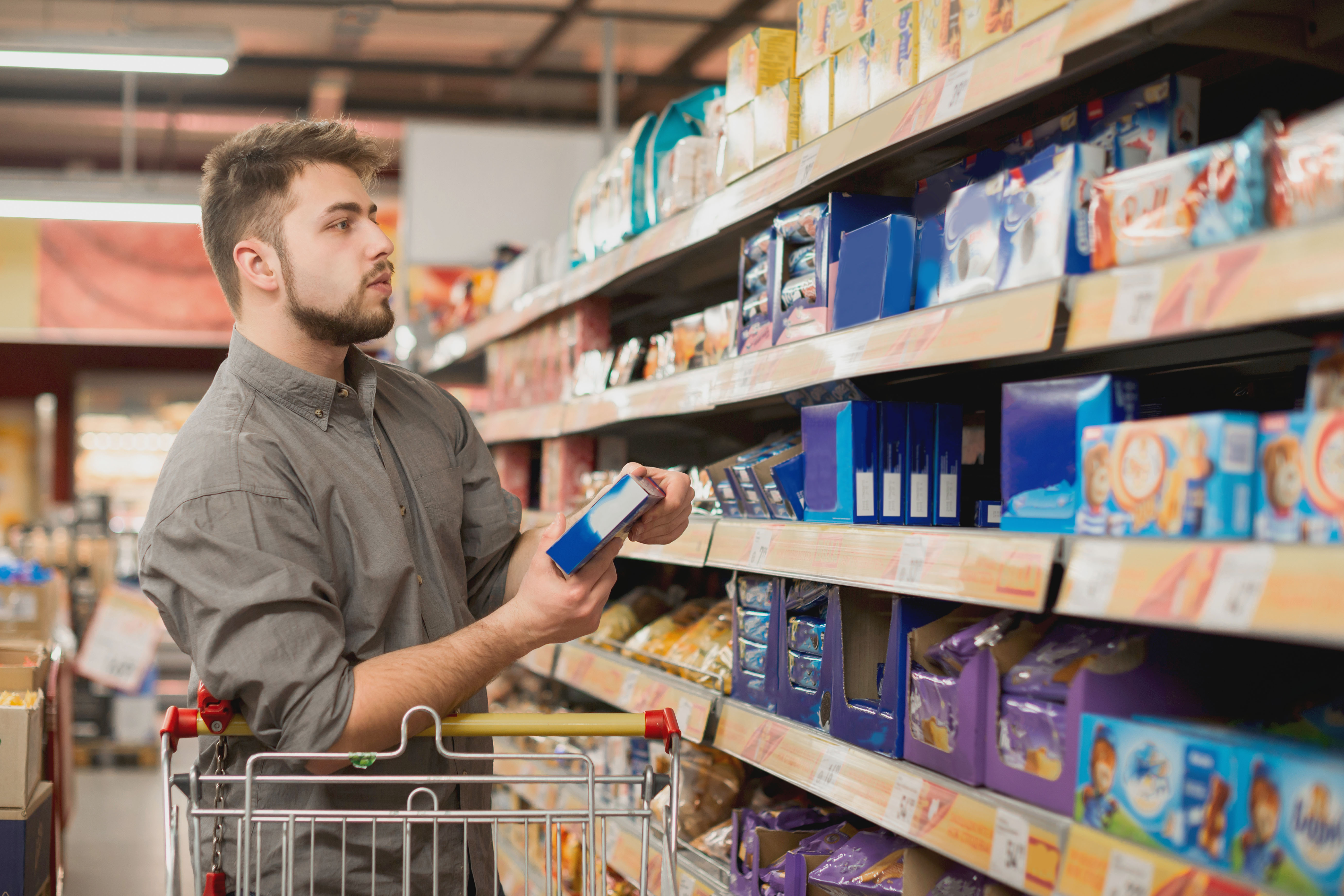 photo of male grocery shopping
