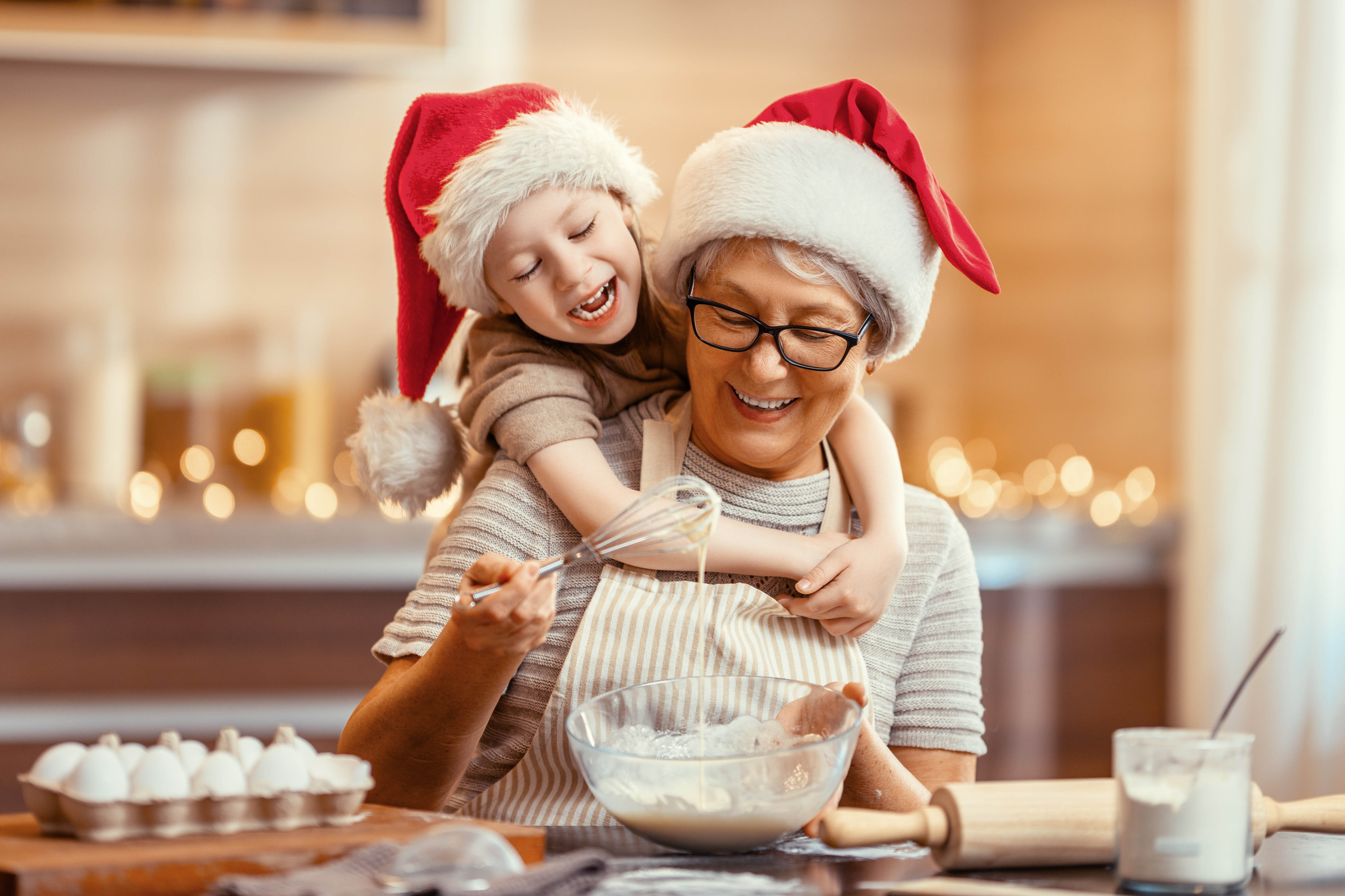 Photo of grandma baking with kid
