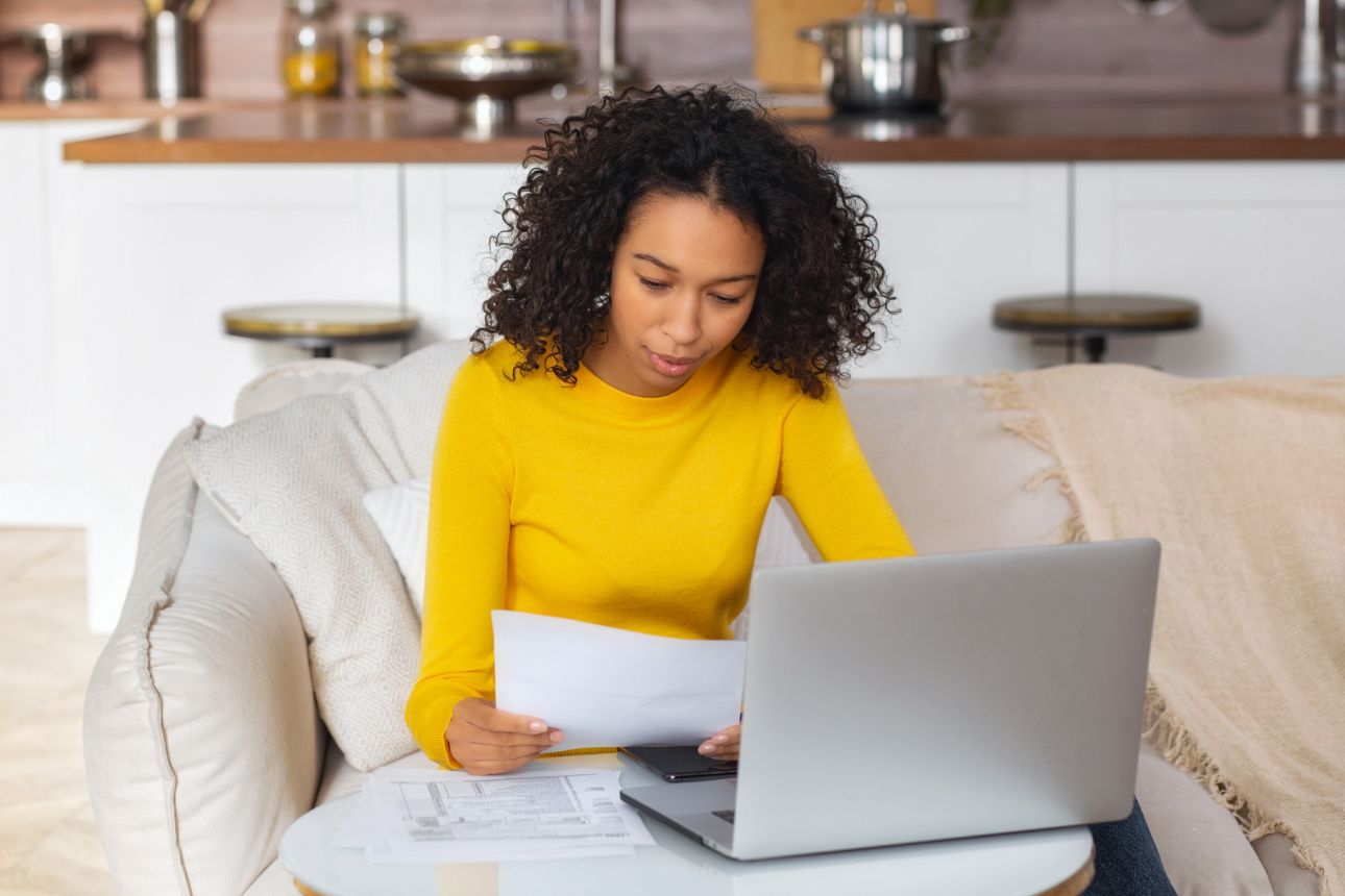 Woman looking at her electricity bill