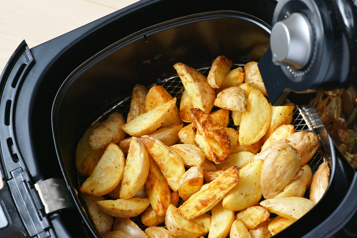 Air fryer cooking chips.