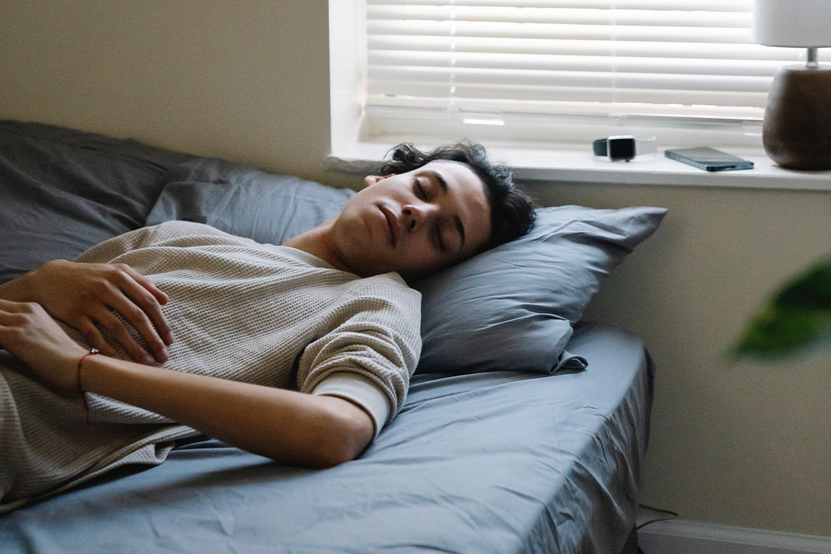 Person sleeping in bed.