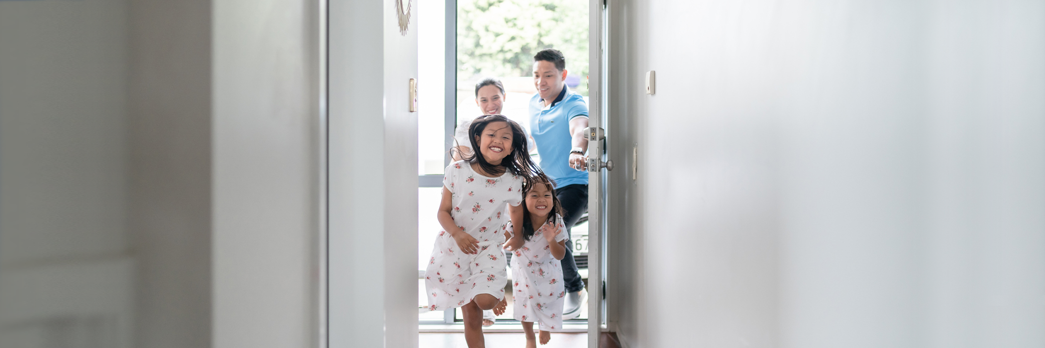 Children running down the hall at home.