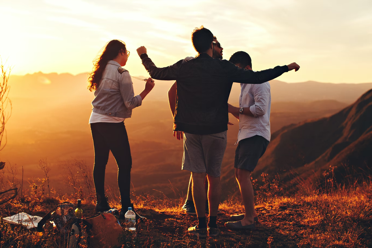 Group of friends dancing outdoors.