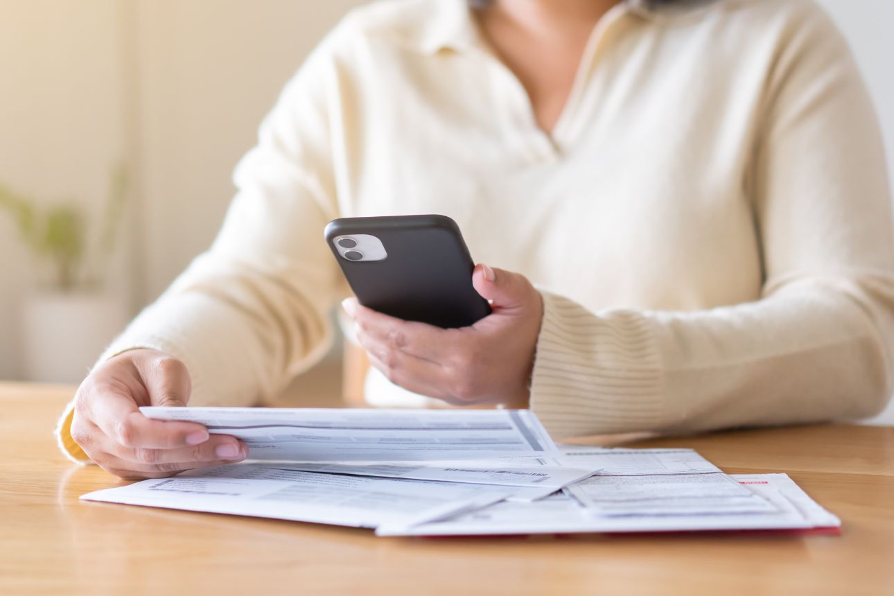 Consumer nz website promo image  a woman reviews her power bill width