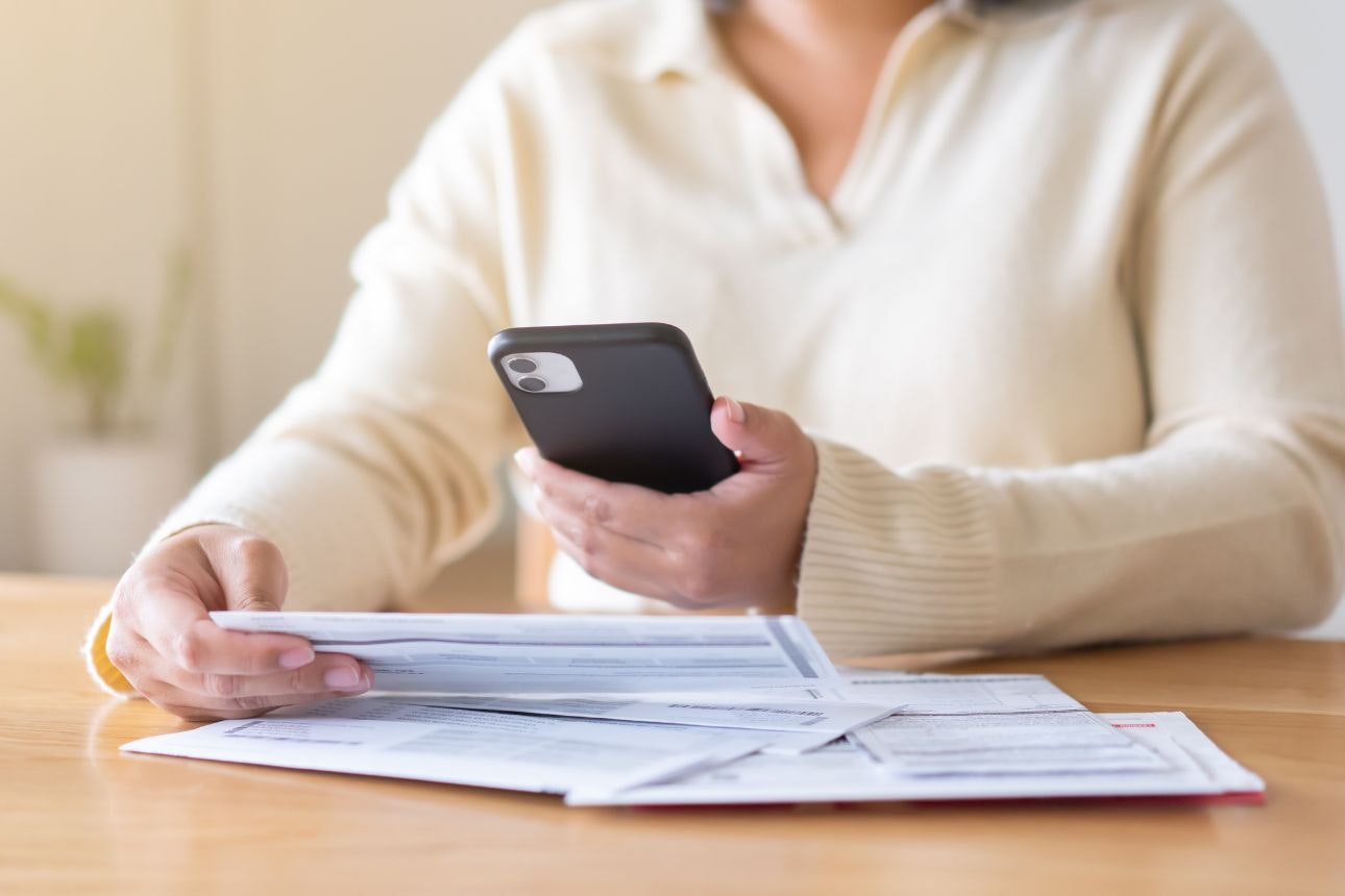 Consumer nz website promo image a woman reviews her power bill width