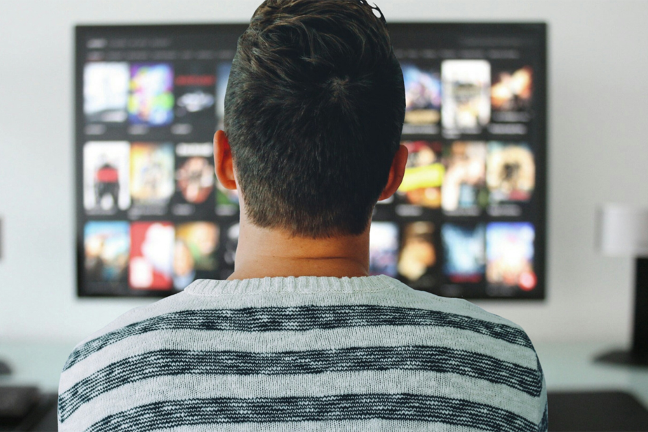 Image of a man watching TV