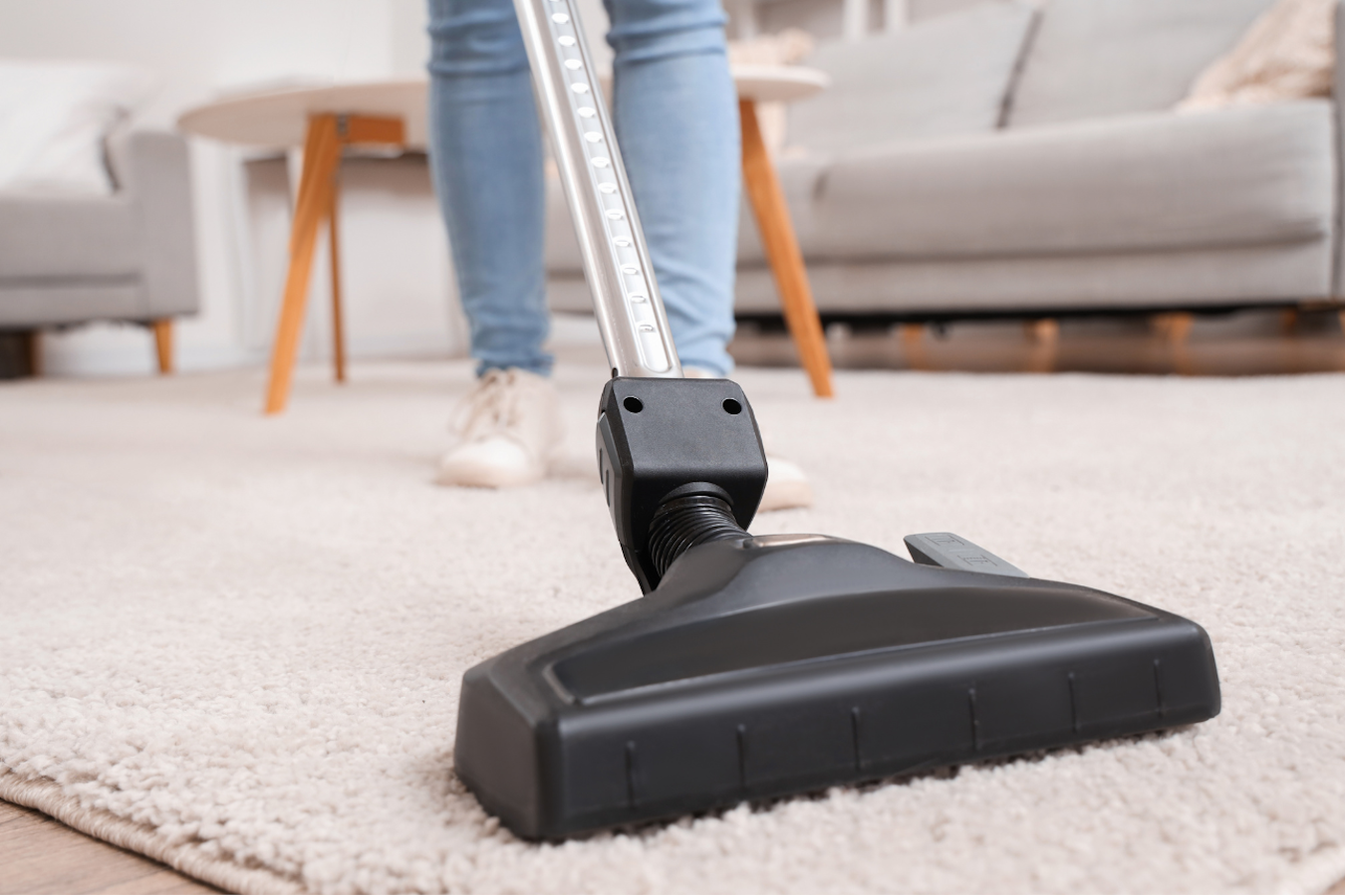 Stick vacuum on carpet.