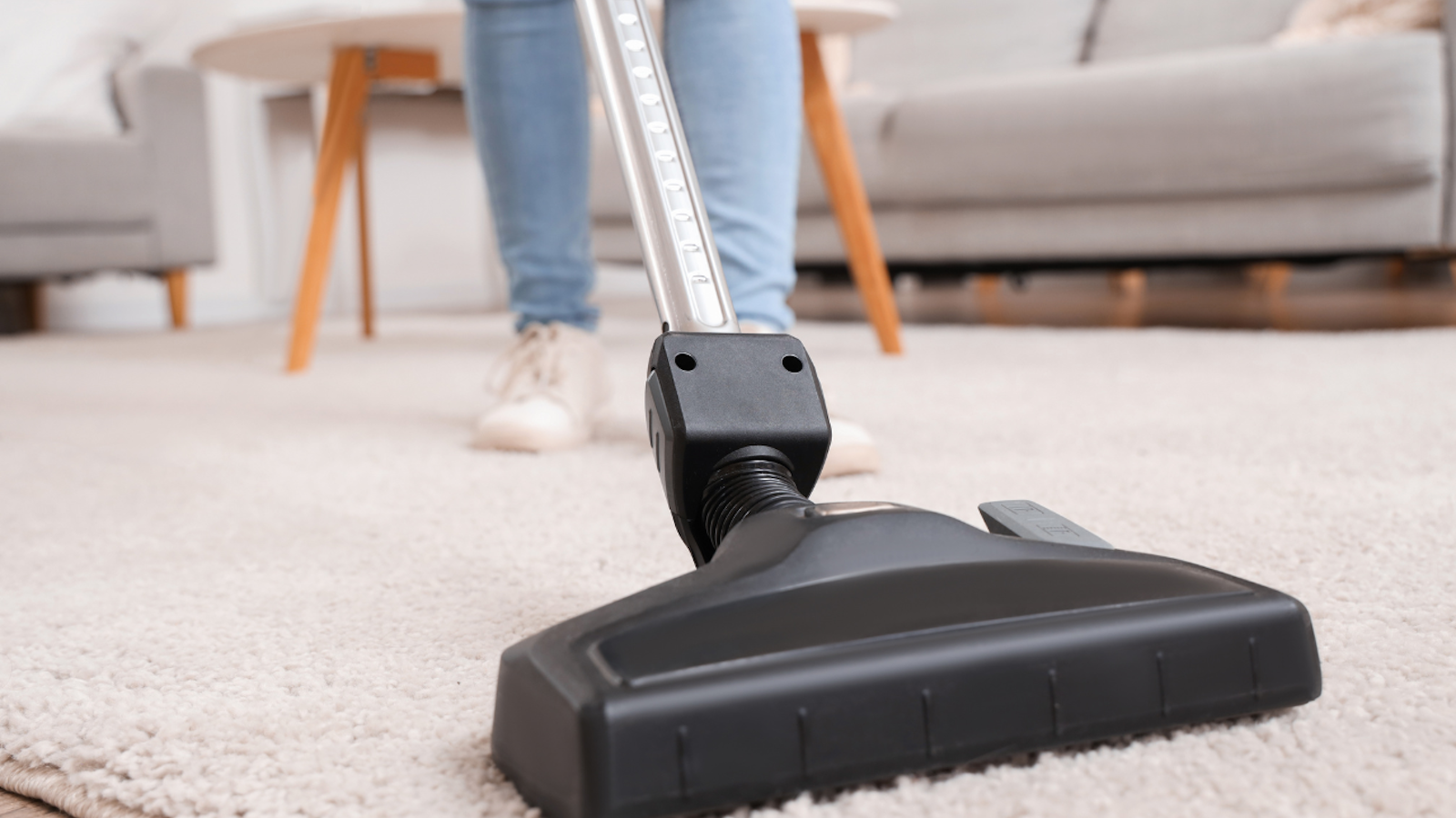 Stick vacuum on carpet.