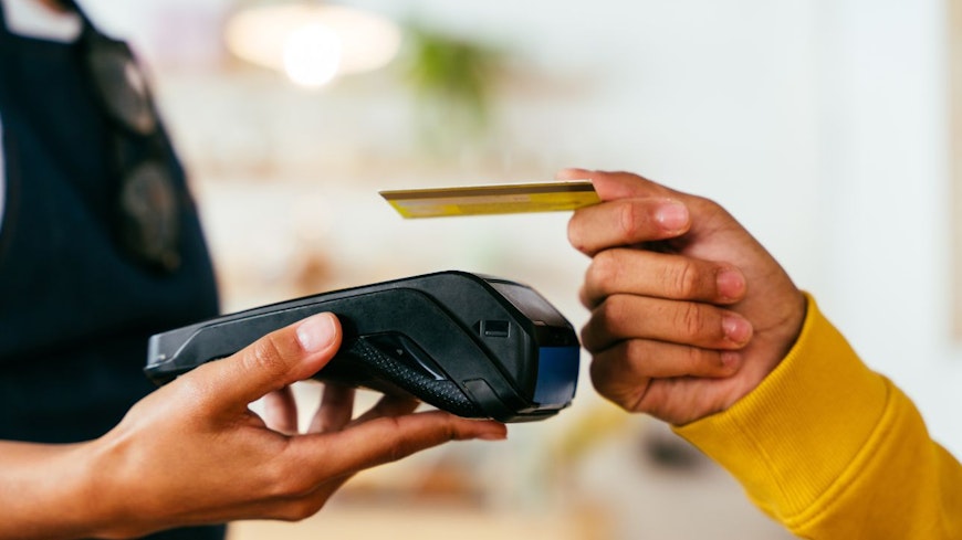 Consumer nz website promo image a customer pays for their brunch on a public holiday width