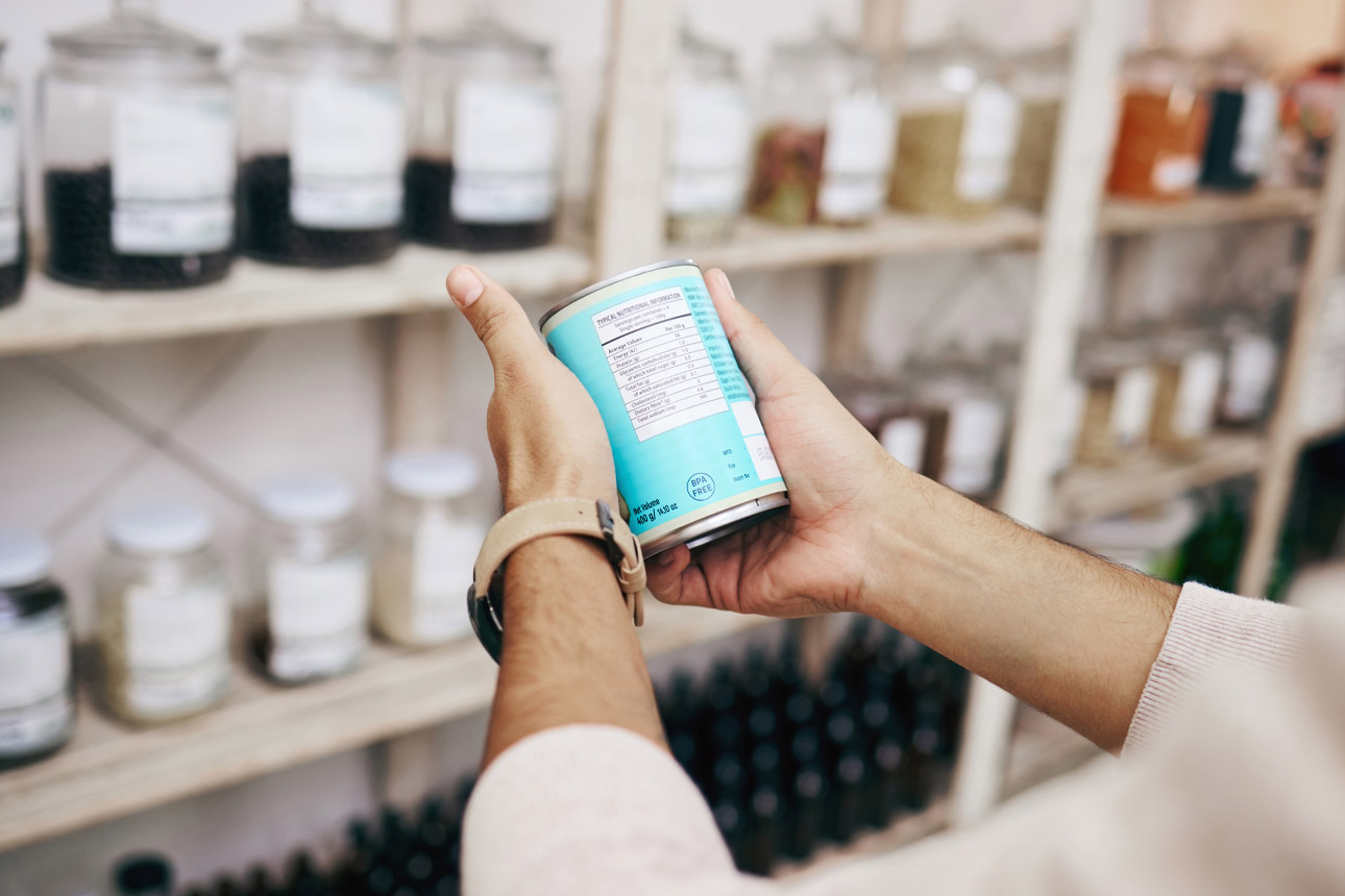 Image of a woman looking at canned food