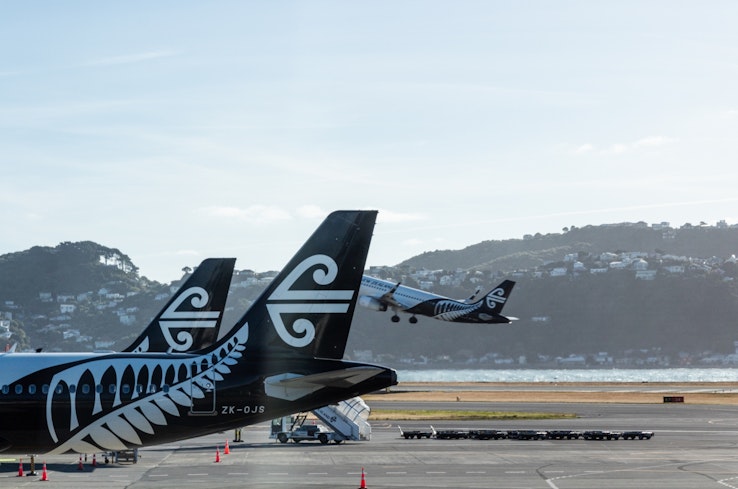 Planes at an airport. width