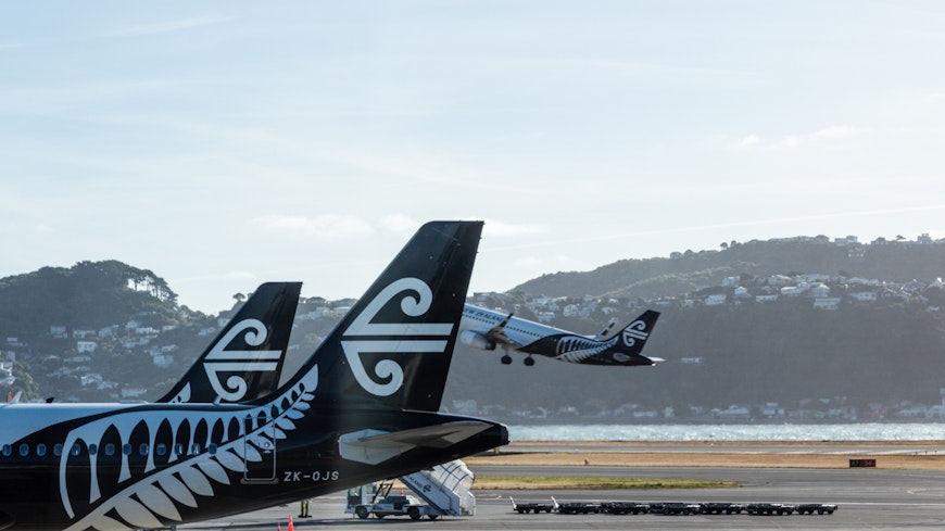 Planes at an airport. width