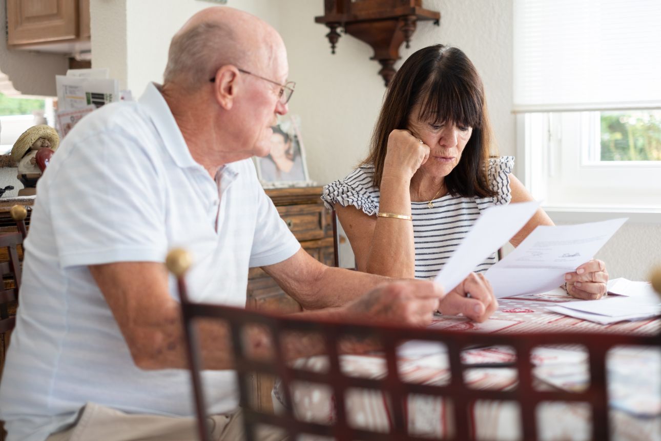 Consumer nz website promo image  senior couple sitting at home table managing insurance width