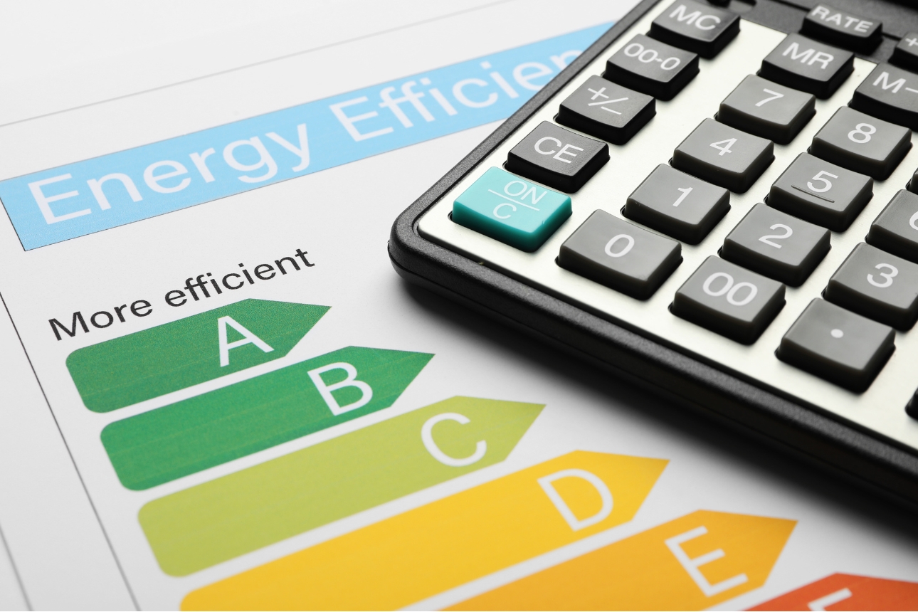 Energy efficiency paper with calculator on top.