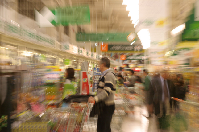 An image with a blur effect suggests that supermarket shopping can be overwhelming