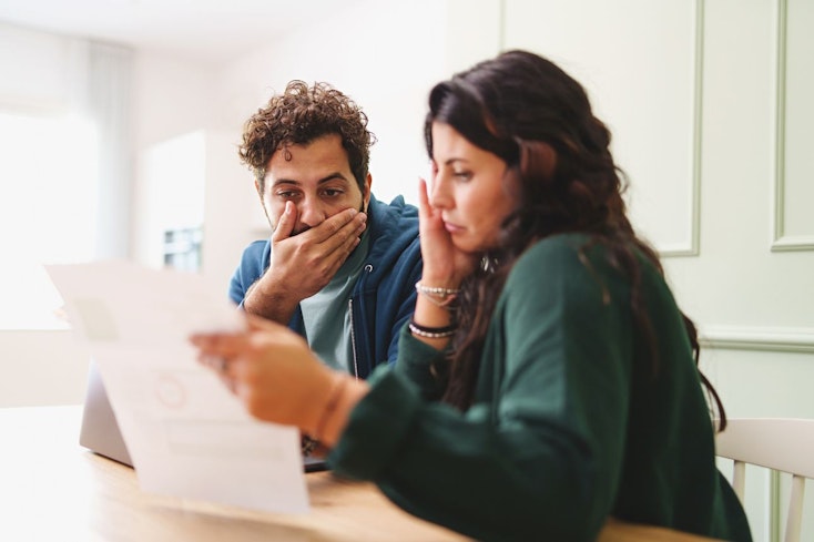 Couple looking at bills