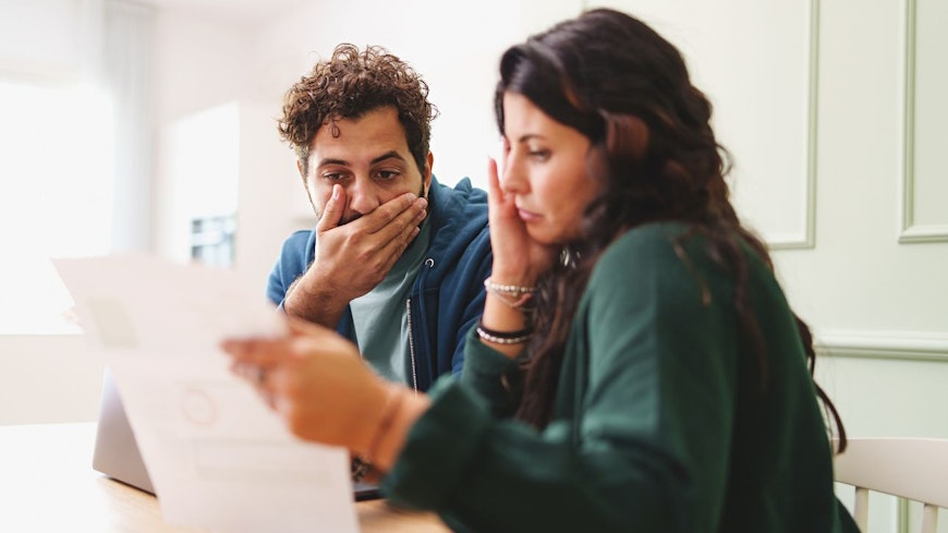 Couple looking at bills