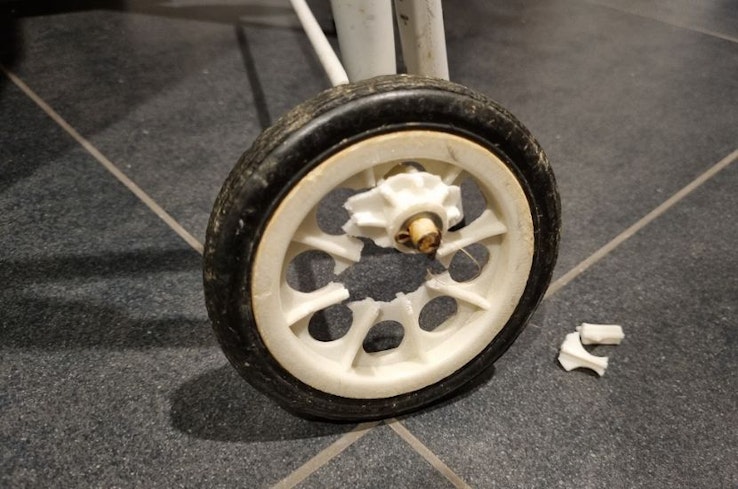 Image of a broken Suzy laundry trundler wheel