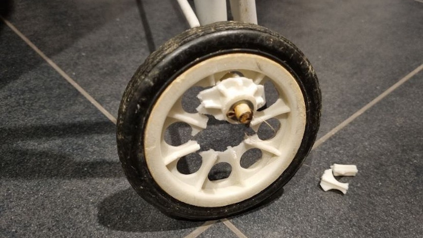 Image of a broken Suzy laundry trundler wheel