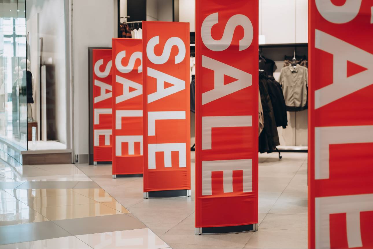 Image of sale signs in front of a store
