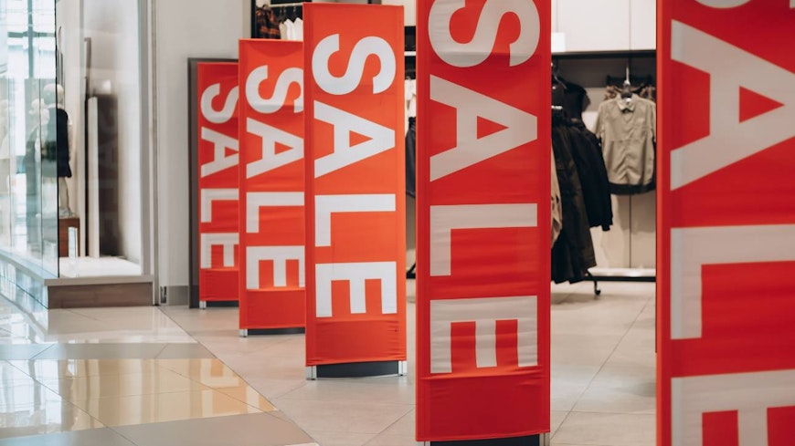 Image of sale signs in front of a store