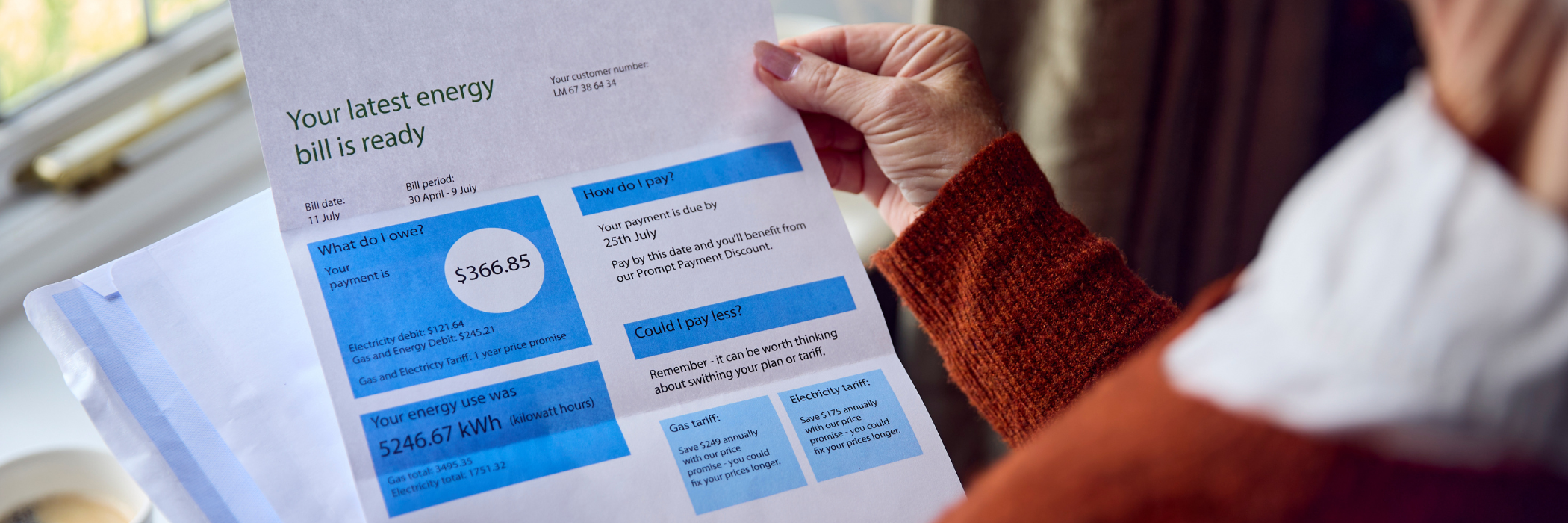 Image of a woman looking at her electricity bill