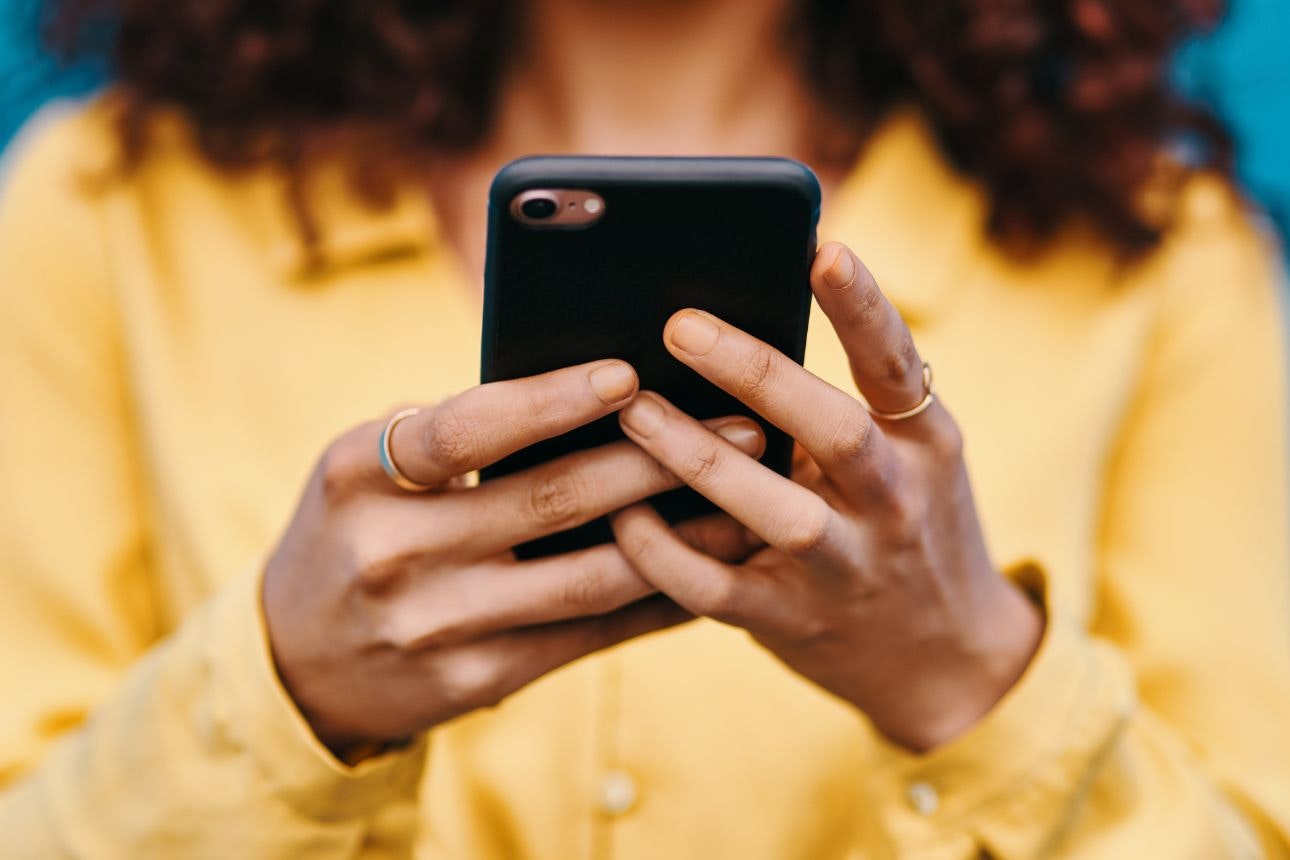 Image of a woman on her phone