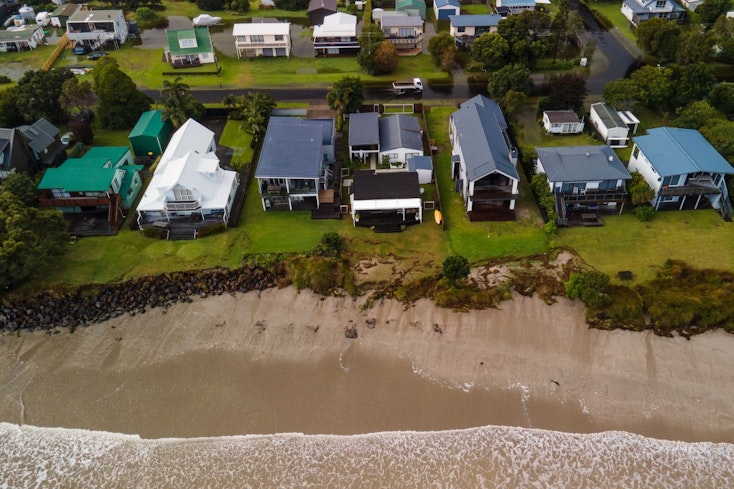 Image of a car driving through floods