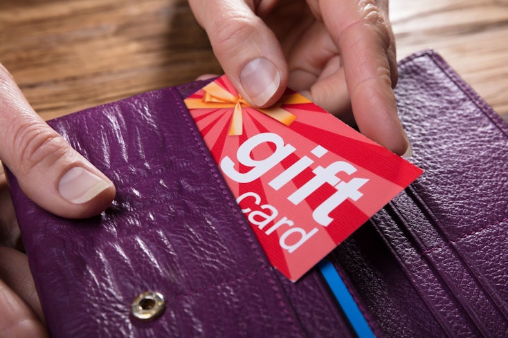 Image of a gift card in a purple wallet