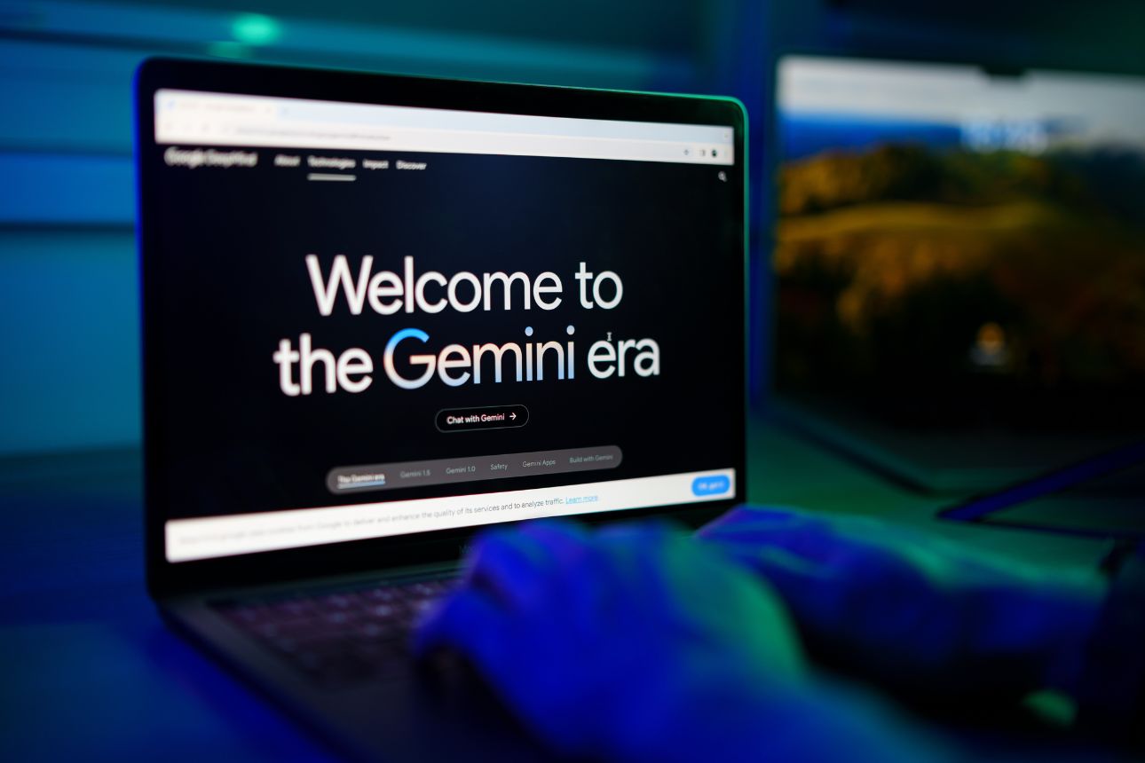 Close-up of man chatting with google Gemini Artificial intelligence Chatbot on computer