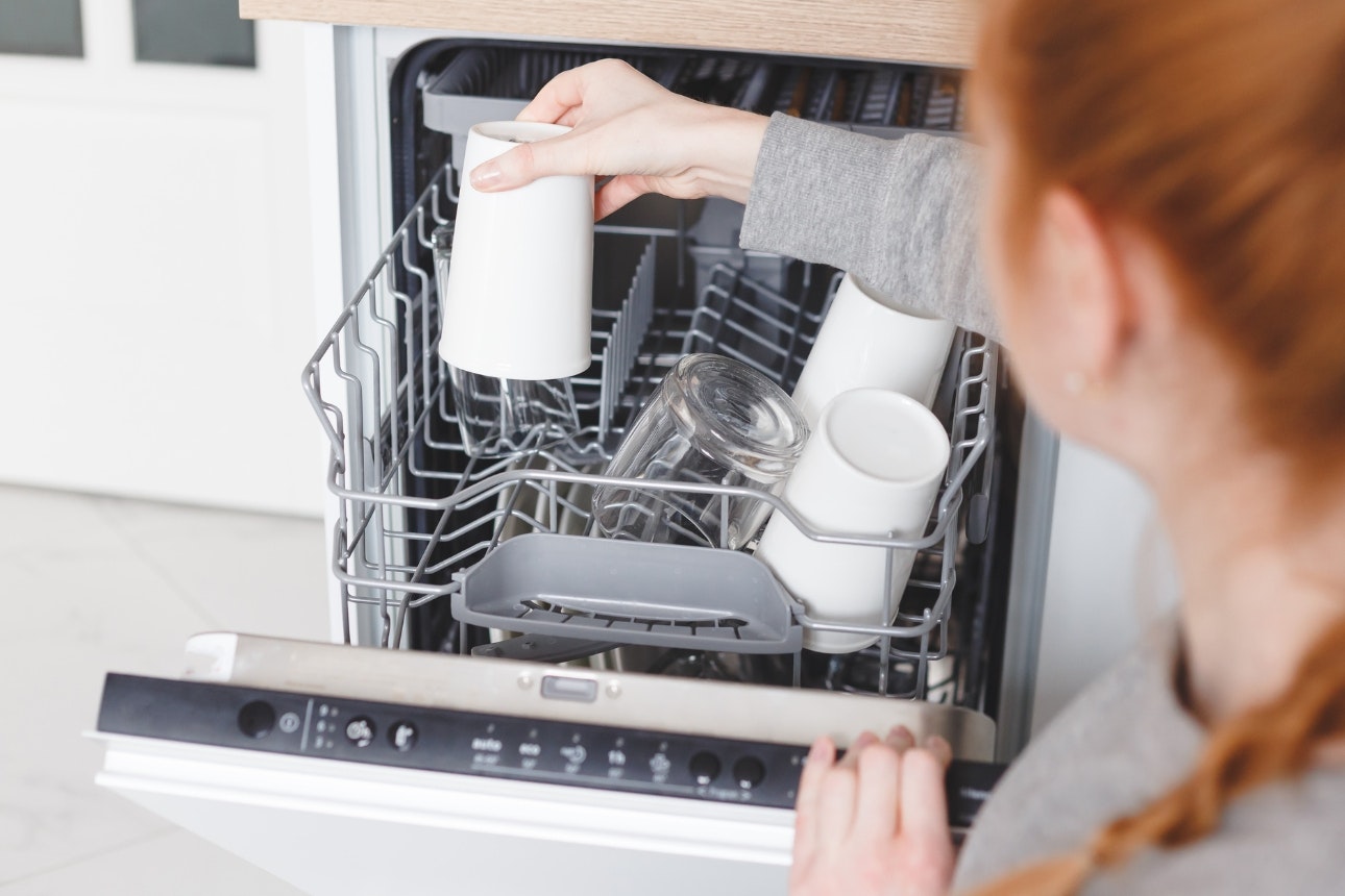 Image of a woman loading the dishwasher