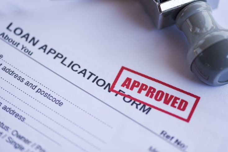 Image of loan documents being approved